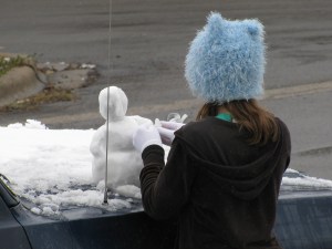 Miniature snowman scraped together off the truck.